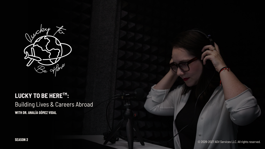 Dr. Analía Gómez Vidal adjusts her headphones in front of a Shure microphone in a dark, foam-lined recording booth. Season 2 cover art for Lucky To Be Here™: Building Lives & Careers Abroad, with a hand-drawn logo of a globe and an airplane. La Dra. Analía Gómez Vidal se ajusta los audífonos frente a un micrófono Shure en una cabina de grabación oscura con paneles acústicos. Portada de la segunda temporada de Lucky To Be Here™: Building Lives & Careers Abroad, con un logo dibujado a mano de un globo terráqueo y un avión.